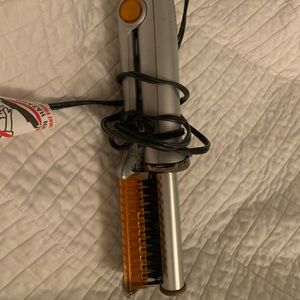 2 instylers: one purple, one silver